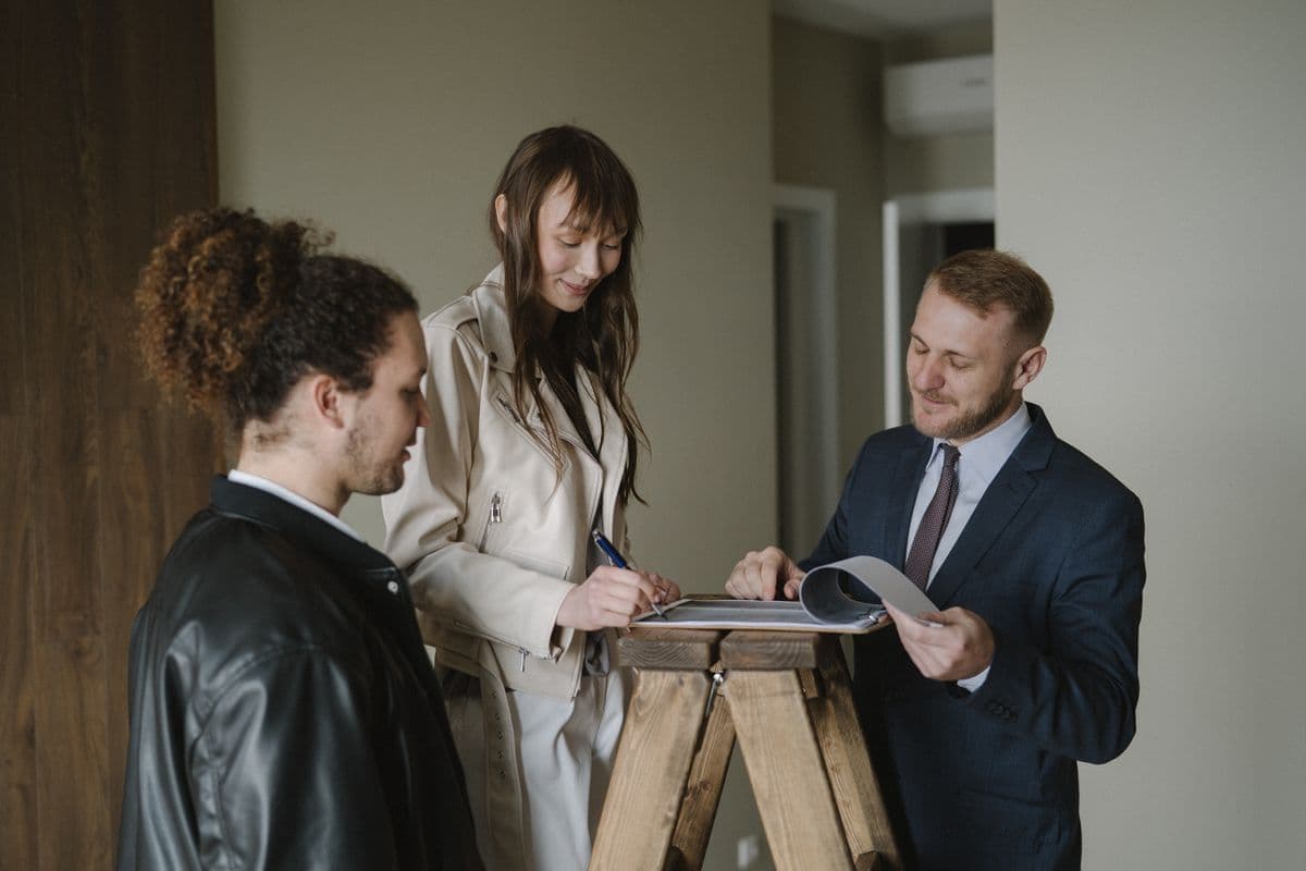 buyer reviewing real estate contract documents at a desk