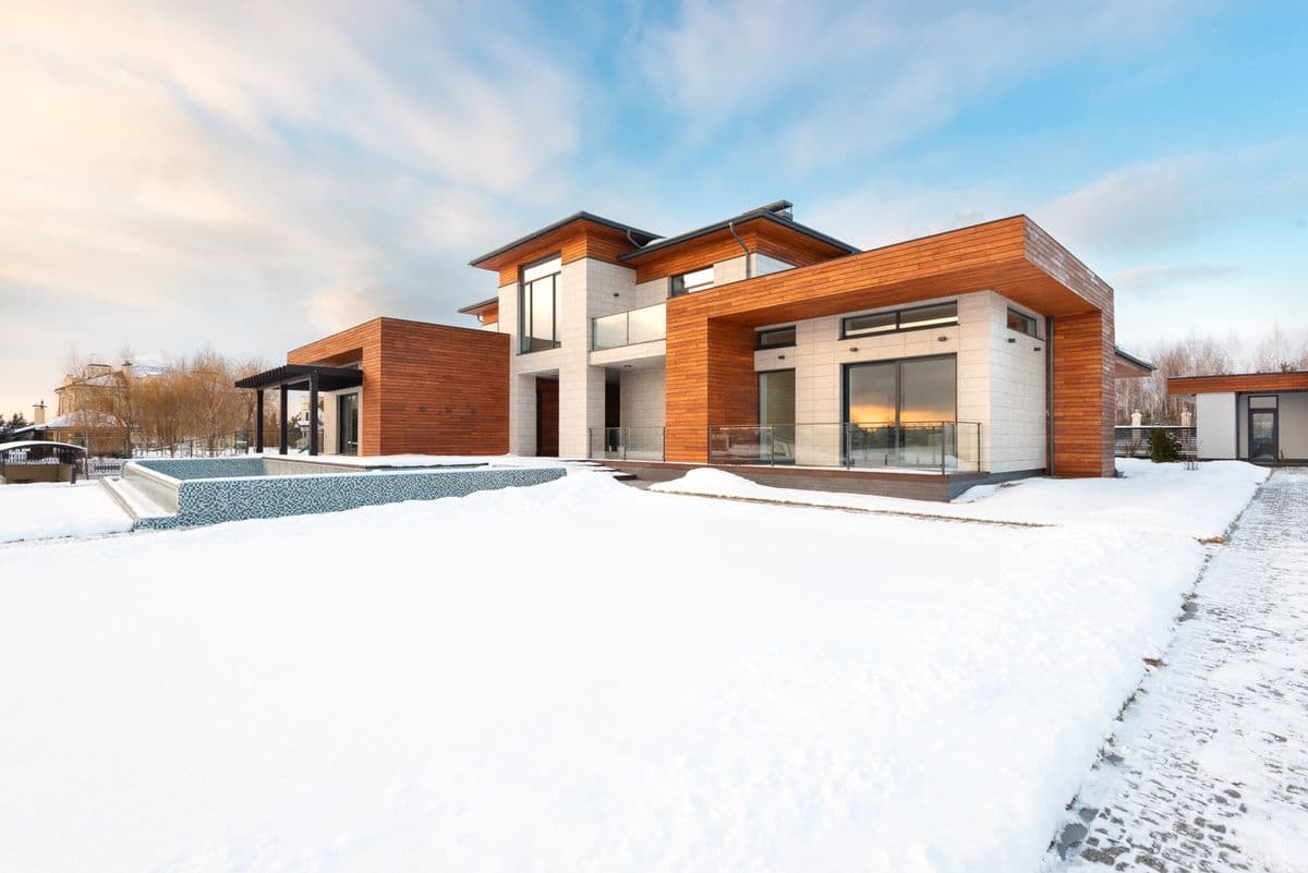 modern home exterior at sunset with warm lighting