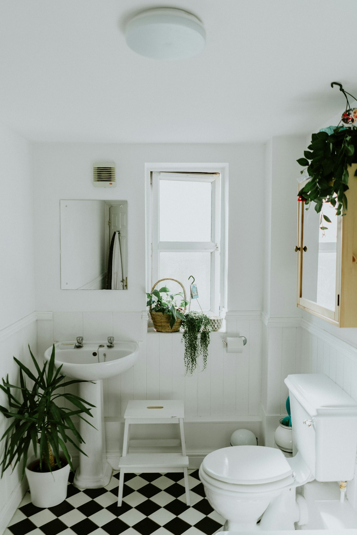 Clean, modern bathroom with white tile and updated vanity